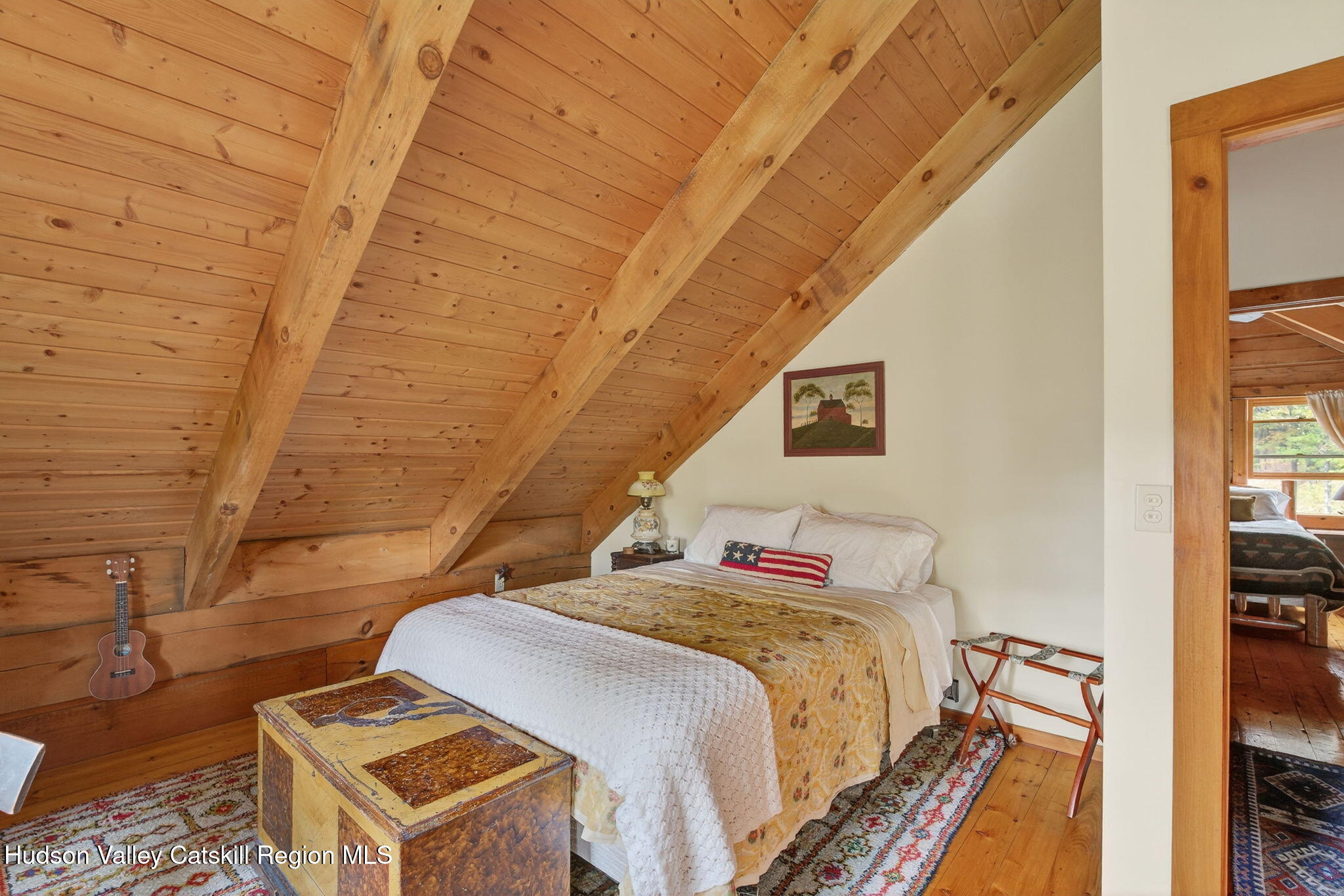 52 Paul Horn Road Catskill, NY 12414 - Photo 31 of 53 a bed sitting in a bedroom next to a window