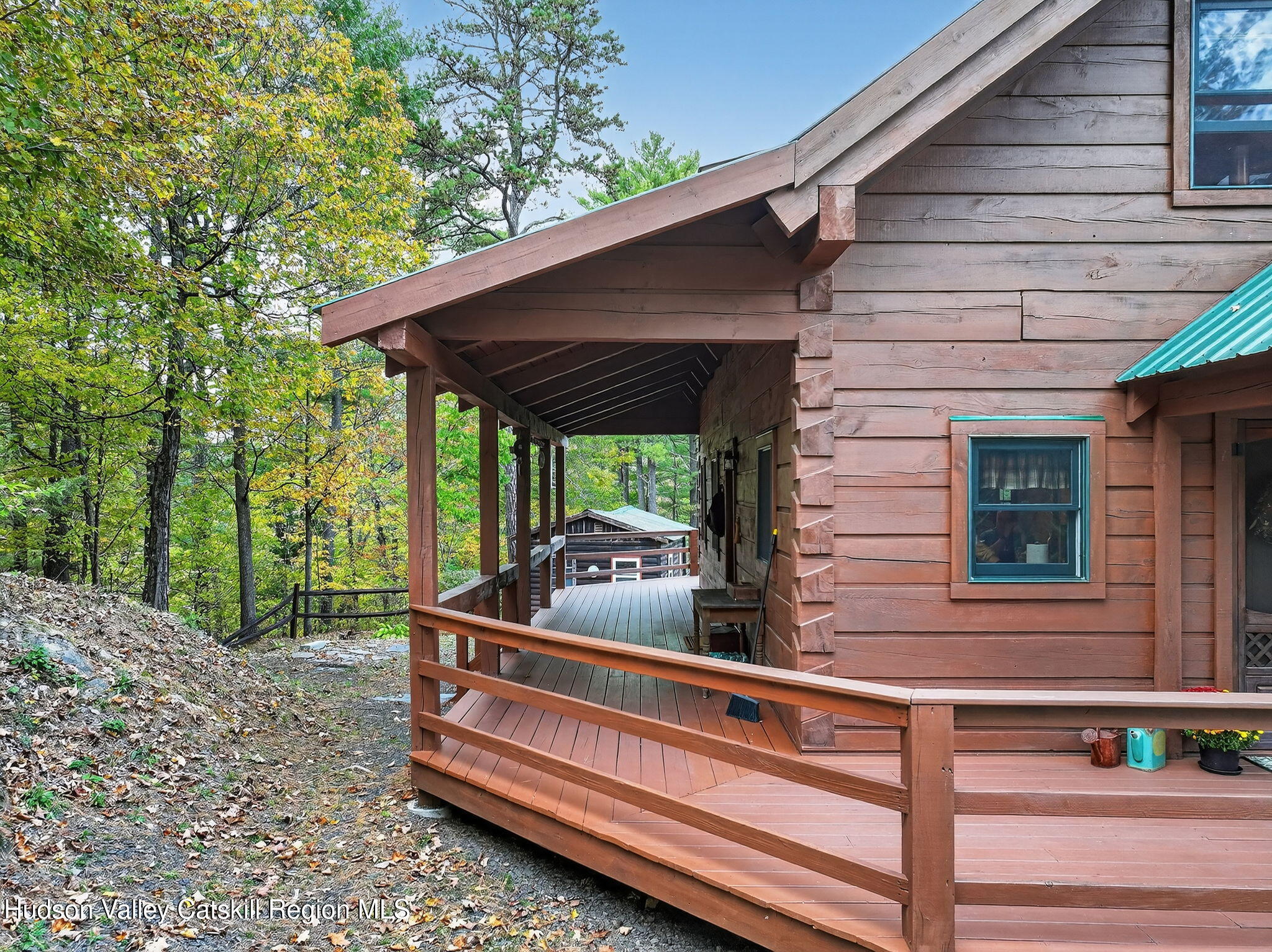 52 Paul Horn Road Catskill, NY 12414 - Photo 35 of 53 a backyard of a house with wooden floor and outdoor seating