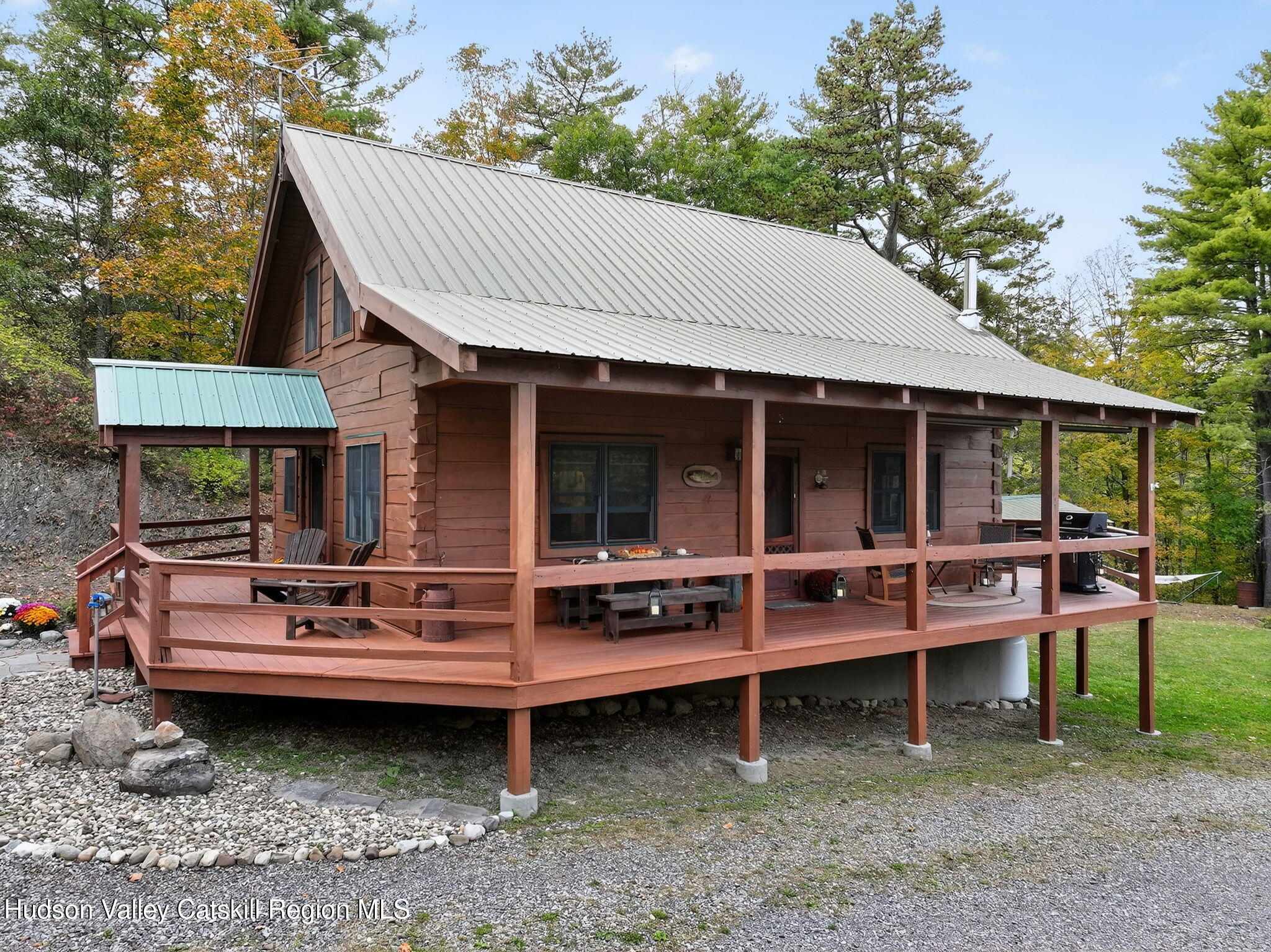 52 Paul Horn Road Catskill, NY 12414 - Photo 36 of 53 a view of a house with a back yard and sitting area