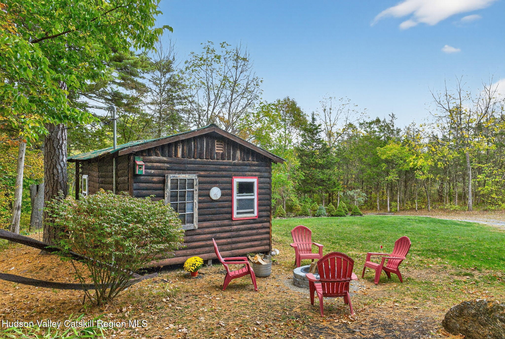 52 Paul Horn Road Catskill, NY 12414 - Photo 40 of 53 a backyard of a house with table and chairs
