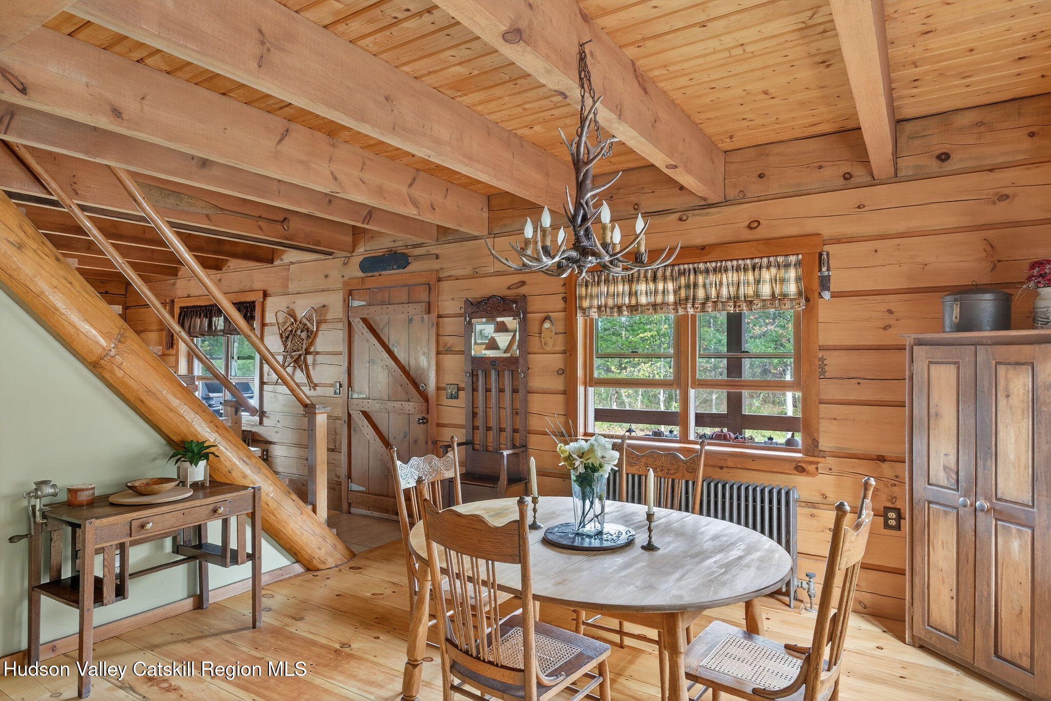 52 Paul Horn Road Catskill, NY 12414 - Photo 4 of 53 a view of a dining room with furniture window and wooden floor