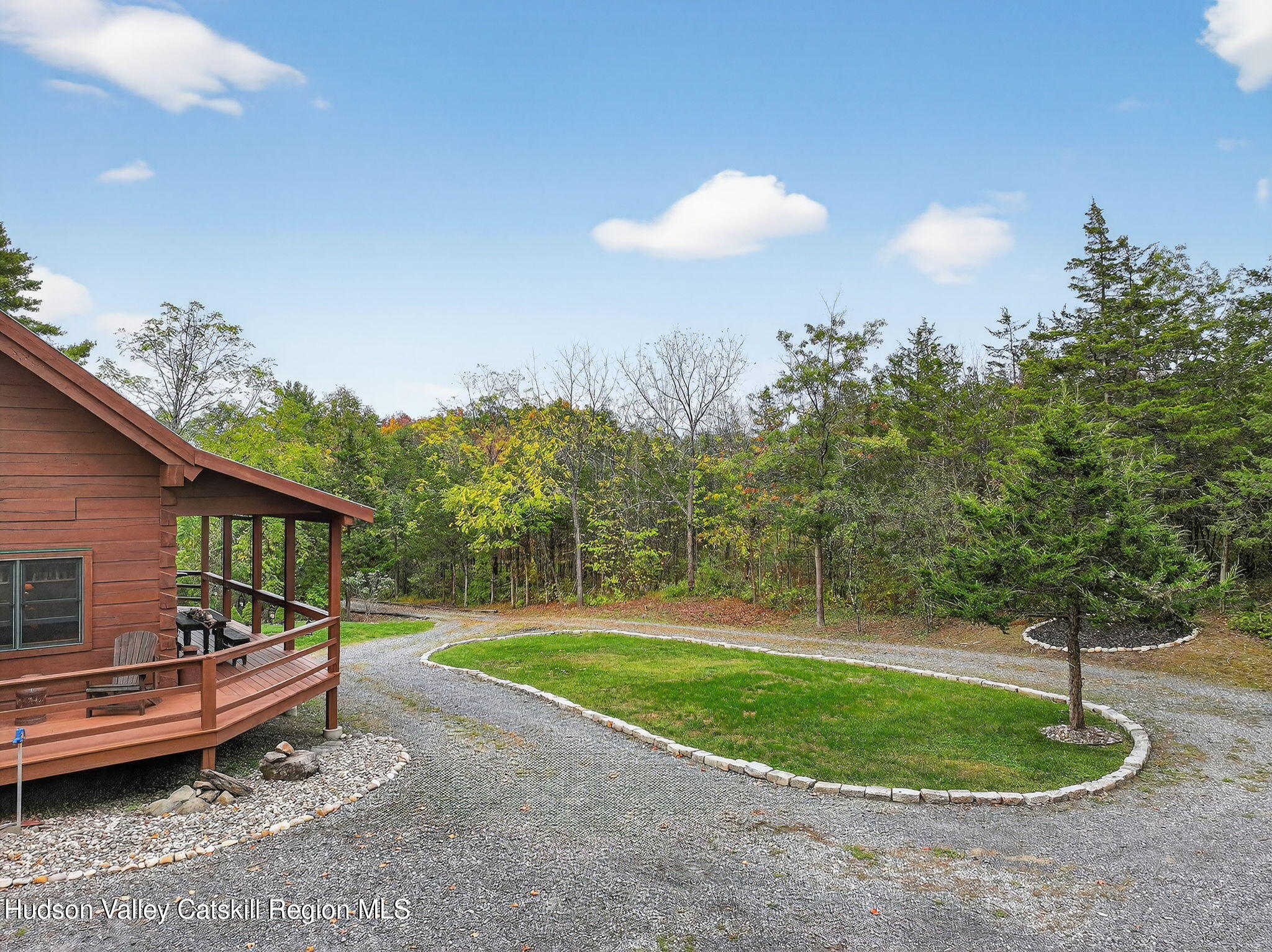 52 Paul Horn Road Catskill, NY 12414 - Photo 45 of 53 a backyard of a house with table and chairs