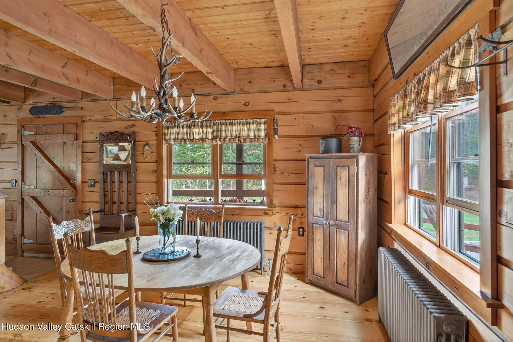 52 Paul Horn Road Catskill, NY 12414 - Photo 6 of 53 a view of a dining room with furniture window and wooden floor