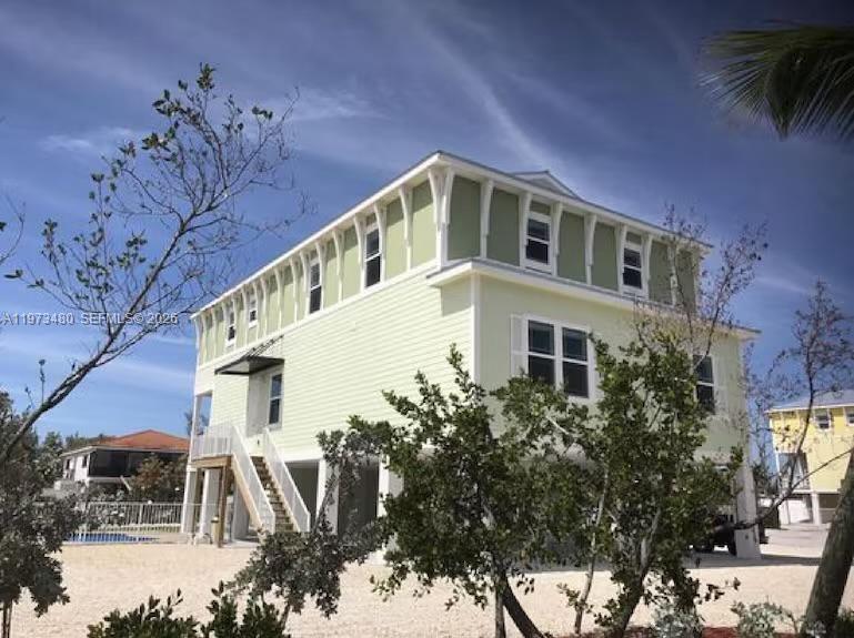 227 Sombrero Beach Road Marathon, FL 33050 - Photo 1 of 56 a very nice looking building with large windows