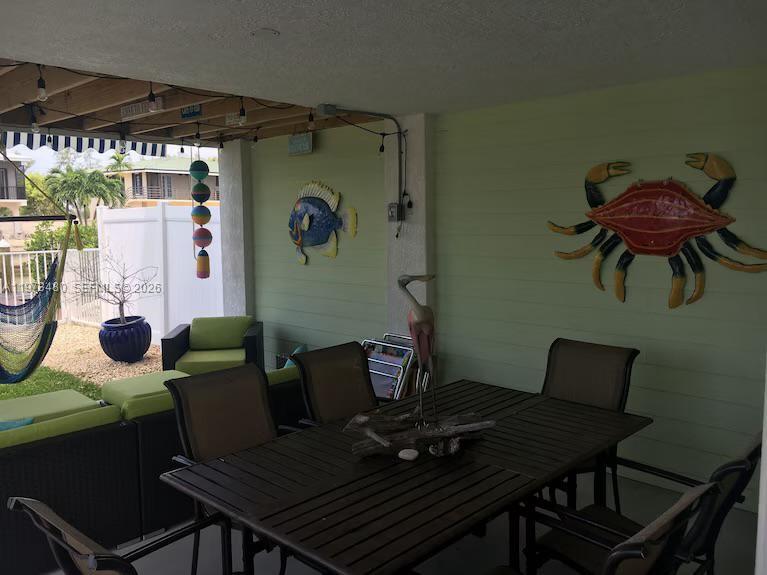 227 Sombrero Beach Road Marathon, FL 33050 - Photo 23 of 56 a dining room with furniture and window