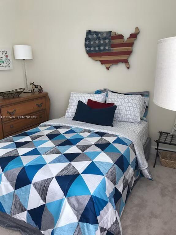227 Sombrero Beach Road Marathon, FL 33050 - Photo 47 of 56 a bedroom with a bed and a lamp on dresser