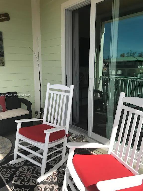 227 Sombrero Beach Road Marathon, FL 33050 - Photo 50 of 56 a bedroom with a bed and a dresser