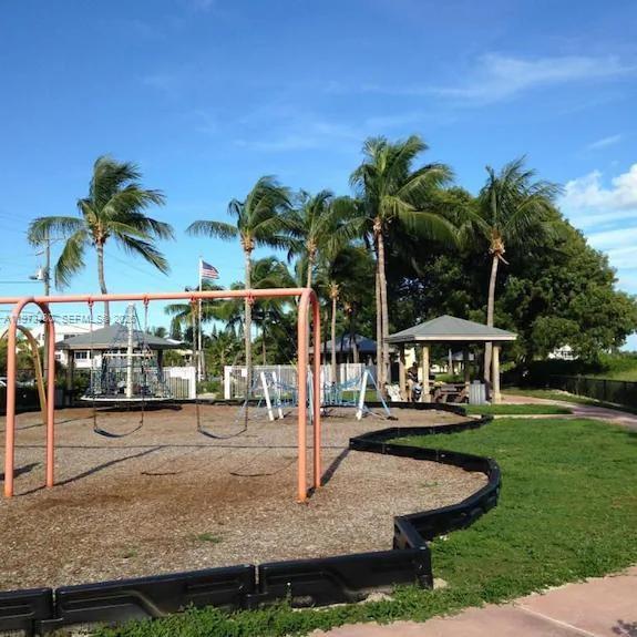 227 Sombrero Beach Road Marathon, FL 33050 - Photo 54 of 56 a view of a house with swimming pool and sitting area