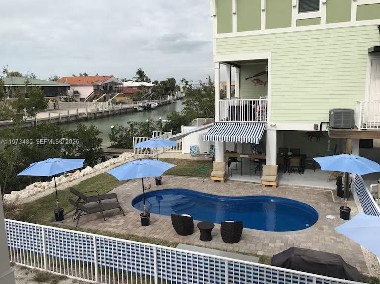 227 Sombrero Beach Road Marathon, FL 33050 - Photo 7 of 56 a view of a roof deck with furniture