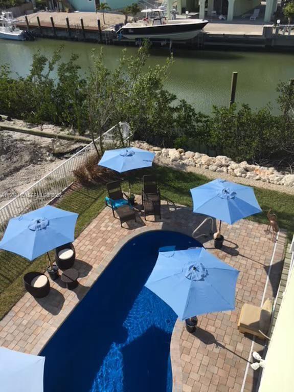 227 Sombrero Beach Road Marathon, FL 33050 - Photo 8 of 56 an aerial view of a house with outdoor space lake view