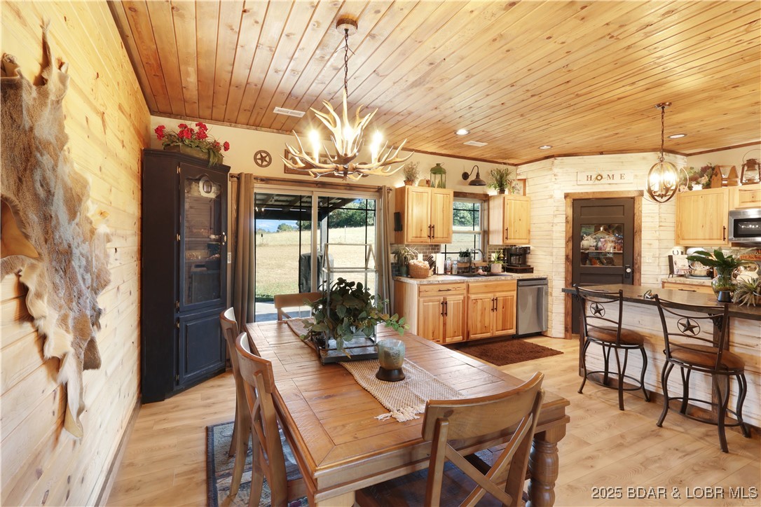 118 Uncle Dee Road Brumley, MO 65017 - Photo 16 of 57 Dining area and open concept kitchen.