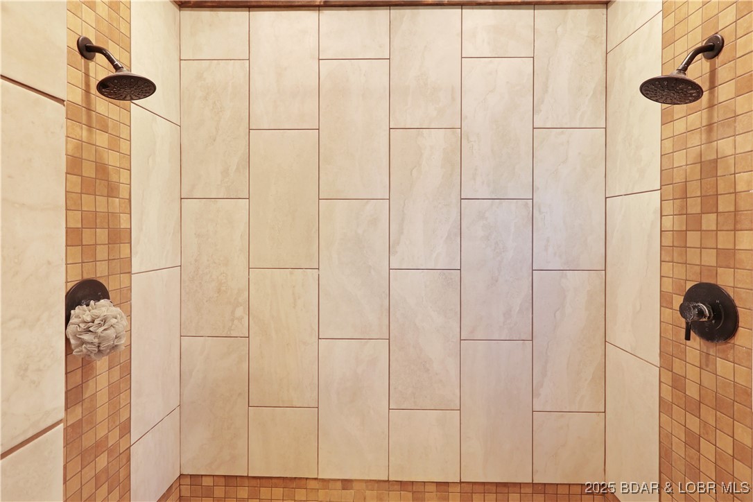 118 Uncle Dee Road Brumley, MO 65017 - Photo 27 of 57 Dual shower heads and beautiful tile work.