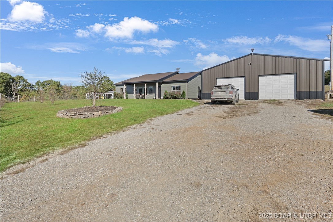 118 Uncle Dee Road Brumley, MO 65017 - Photo 5 of 57 Gentle topography and large 3 car garage.
