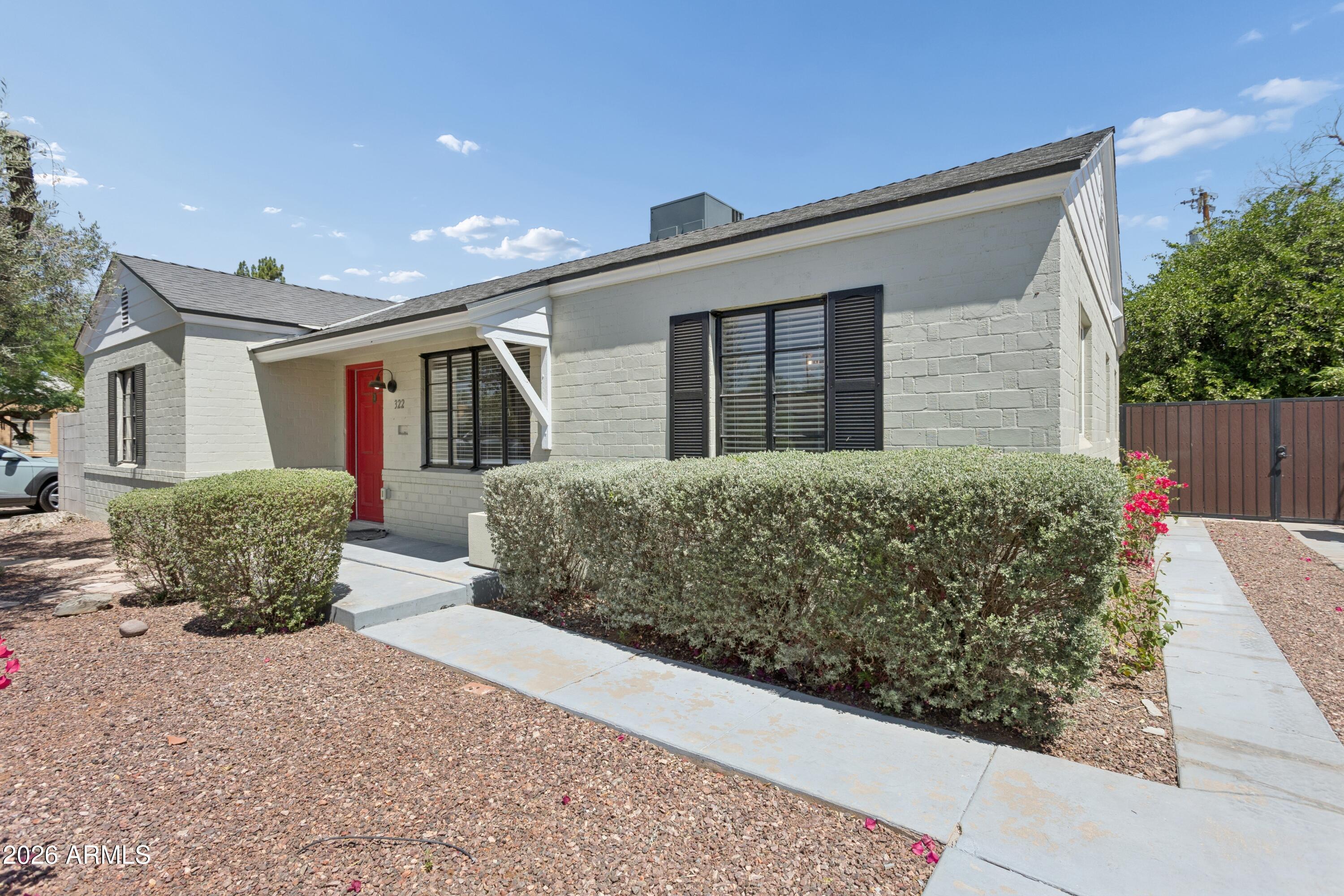 322 West Coronado Road Phoenix, AZ 85003 - Photo 38 of 93 a front view of house with yard and trees in the background