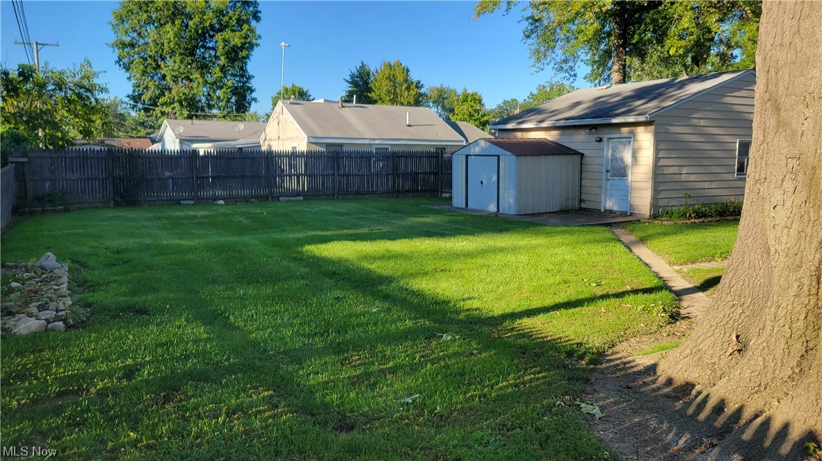 290 Cummings Road Vermilion, OH 44089 - Photo 16 of 18 View of yard featuring a storage unit