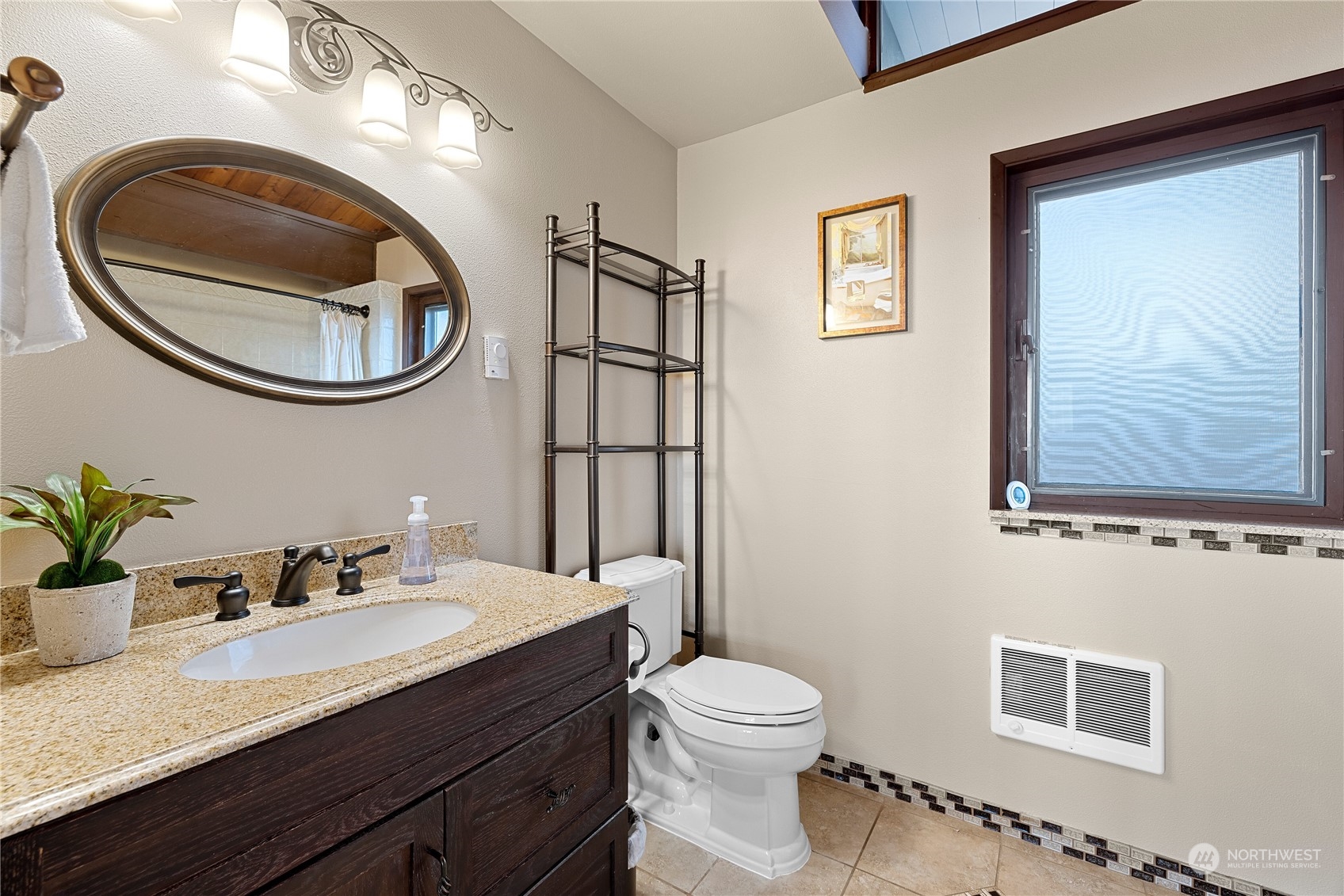 29832 2nd Place Southwest Federal Way, WA 98023 - Photo 12 of 40 a bathroom with a toilet a sink and mirror