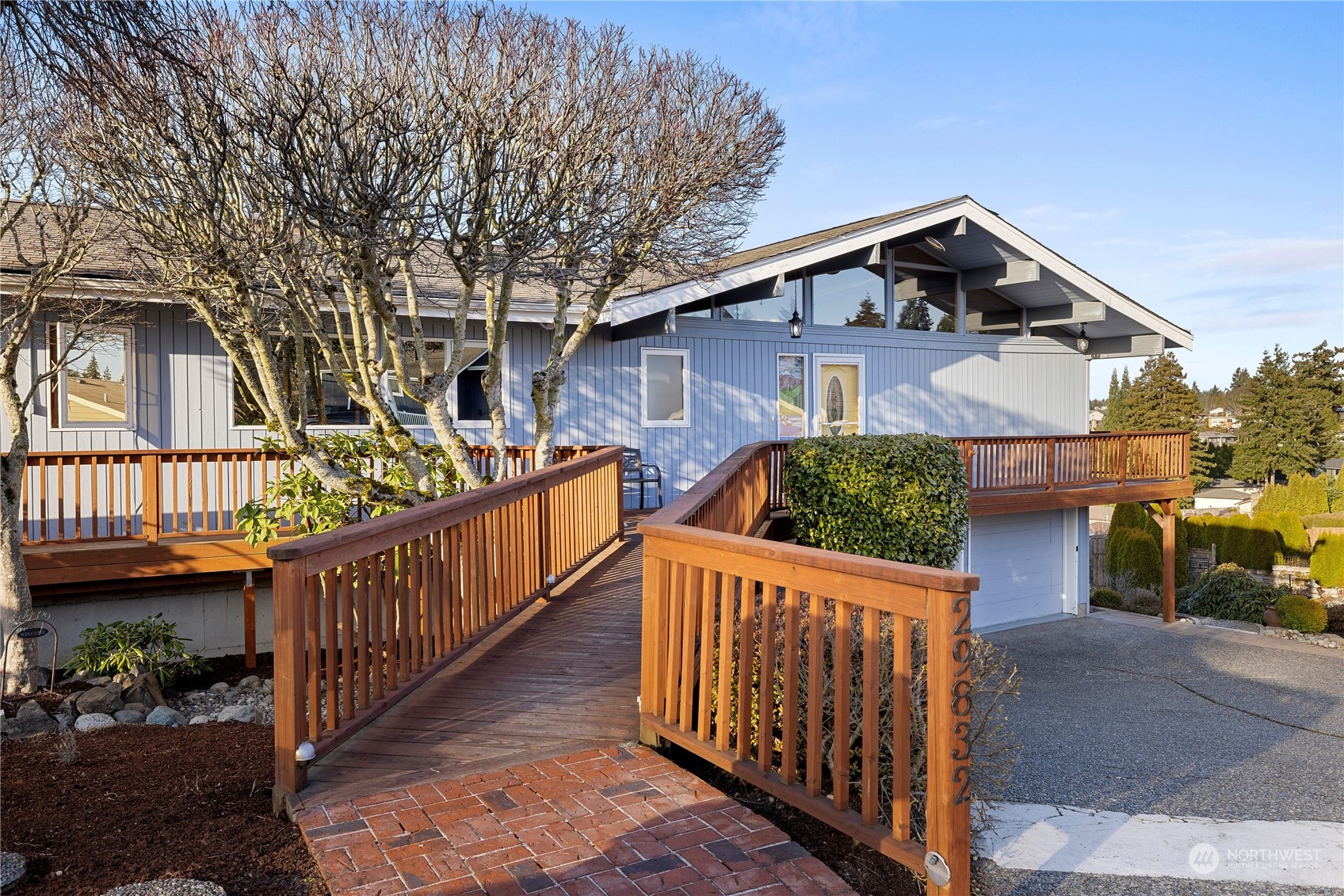 29832 2nd Place Southwest Federal Way, WA 98023 - Photo 2 of 40 a view of a wooden house with large windows