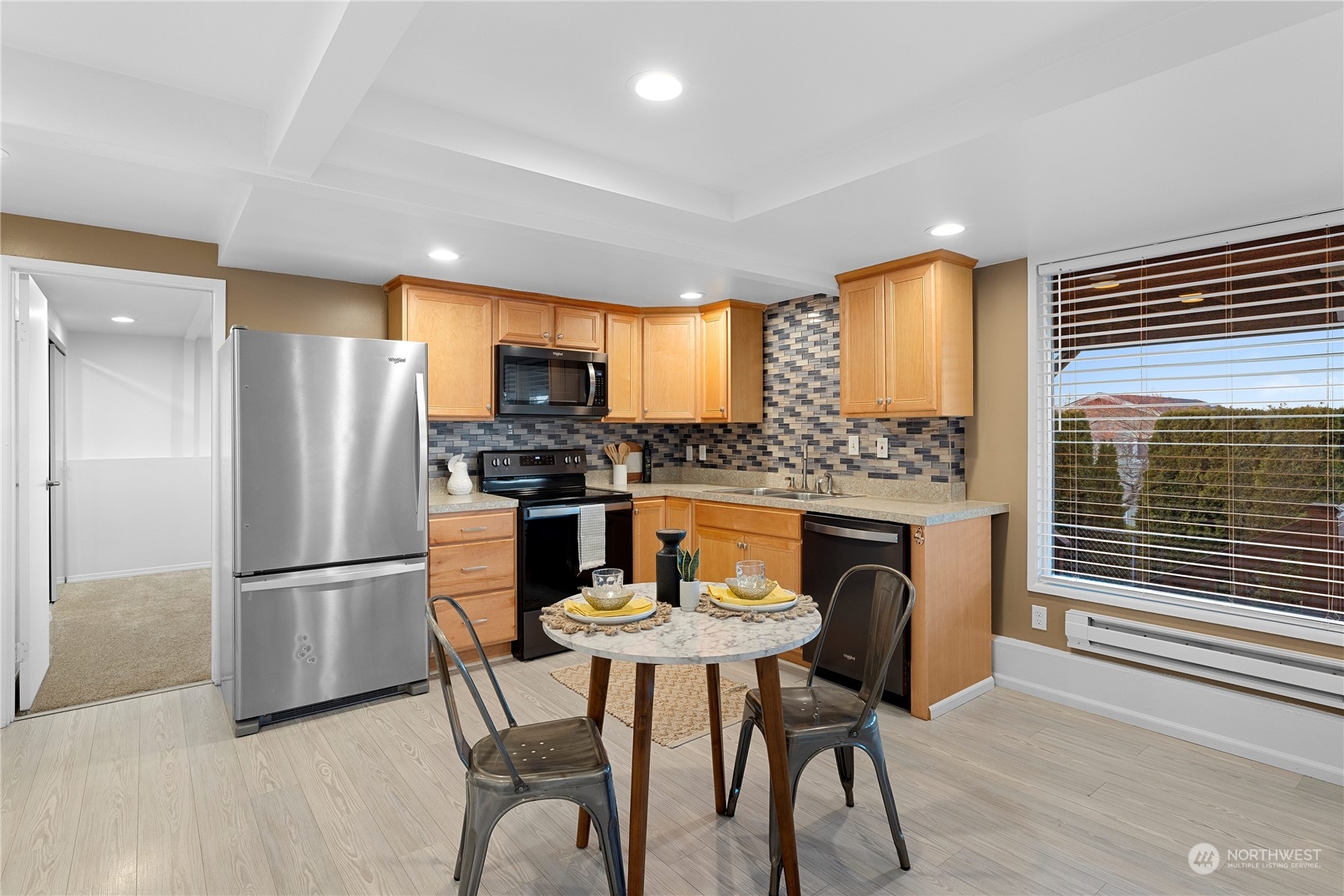 29832 2nd Place Southwest Federal Way, WA 98023 - Photo 22 of 40 a kitchen with stainless steel appliances granite countertop a dining table and chairs