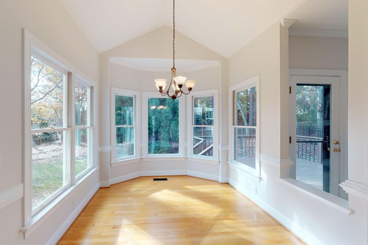 8601 Stanton Place Raleigh, NC 27615 - Photo 9 of 25 Breakfast area and kitchen open to the family room. This area is filled with windows and great natural light. Breakfast Area