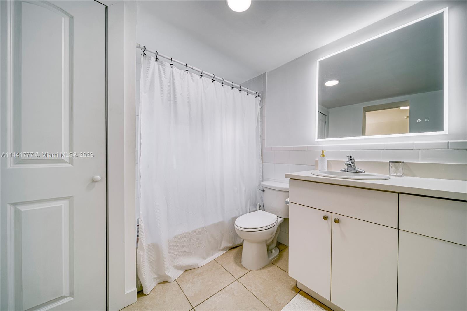 2919 Southwest 25th Terrace Miami, FL 33133 - Photo 13 of 41 a bathroom with a sink toilet and shower