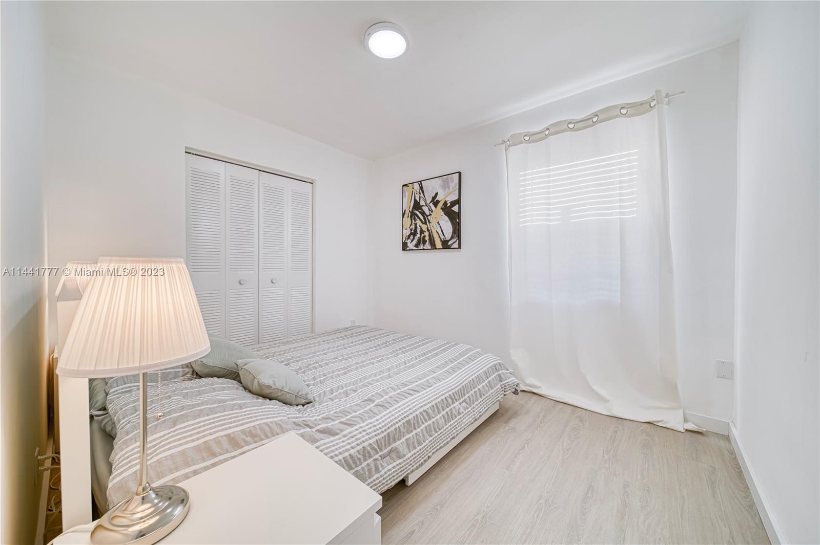 2919 Southwest 25th Terrace Miami, FL 33133 - Photo 8 of 41 a bedroom with a bed and a window