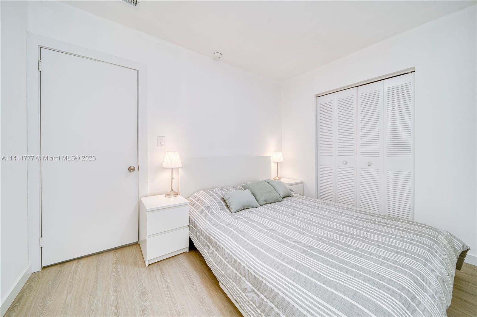 2919 Southwest 25th Terrace Miami, FL 33133 - Photo 9 of 41 a bedroom with a bed and a closet