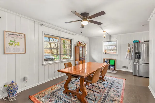 a dining room with furniture and window