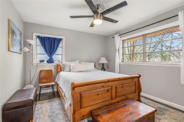 a bedroom with a bed and chair