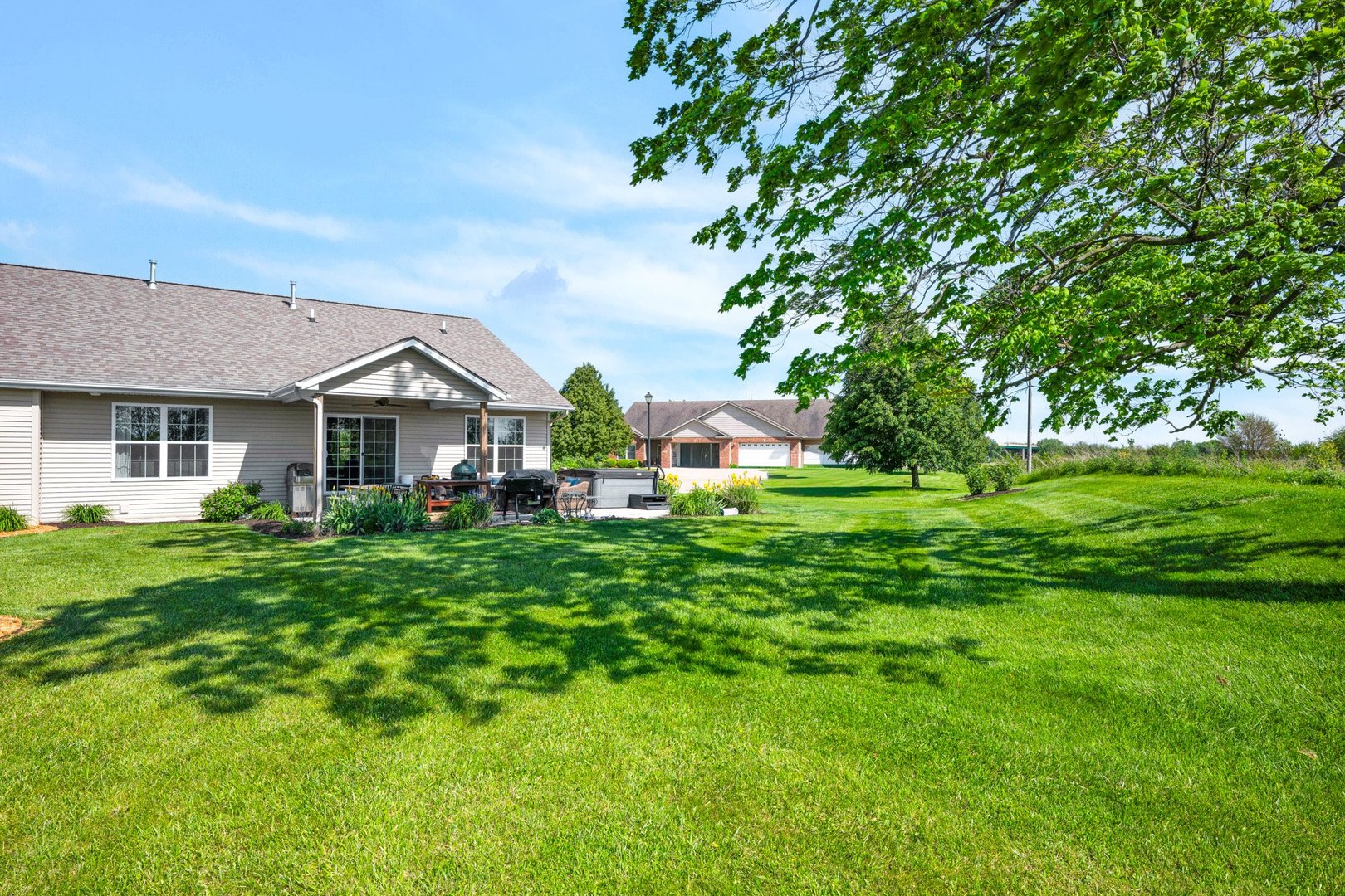 277 Cassidy Road Normal, IL 61761 - Photo 35 of 42 a front view of a house with garden