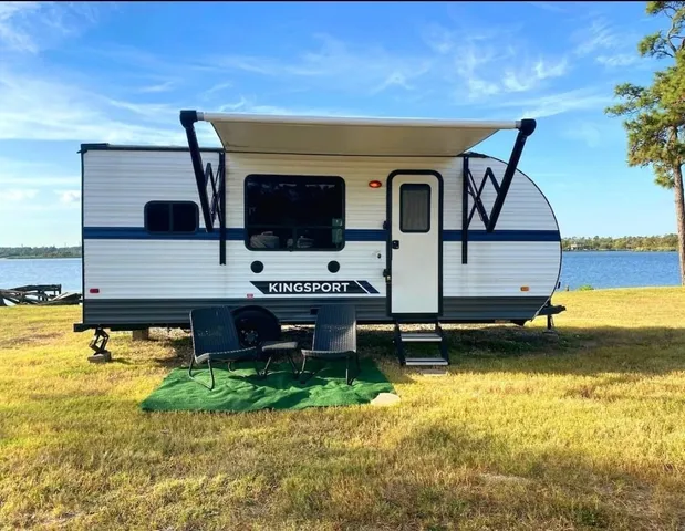 a living room with fireplace furniture and a flat screen tv