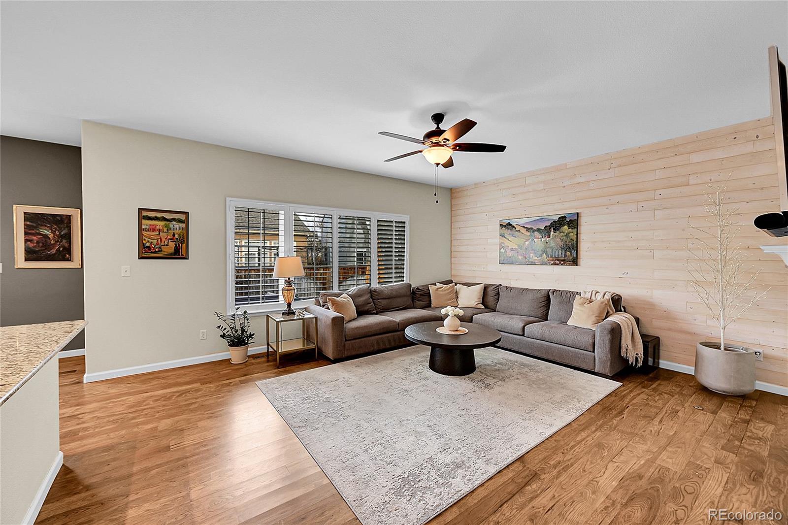 9424 South Hackberry Lane Highlands Ranch, CO 80129 - Photo 16 of 47 a living room with furniture and a large window
