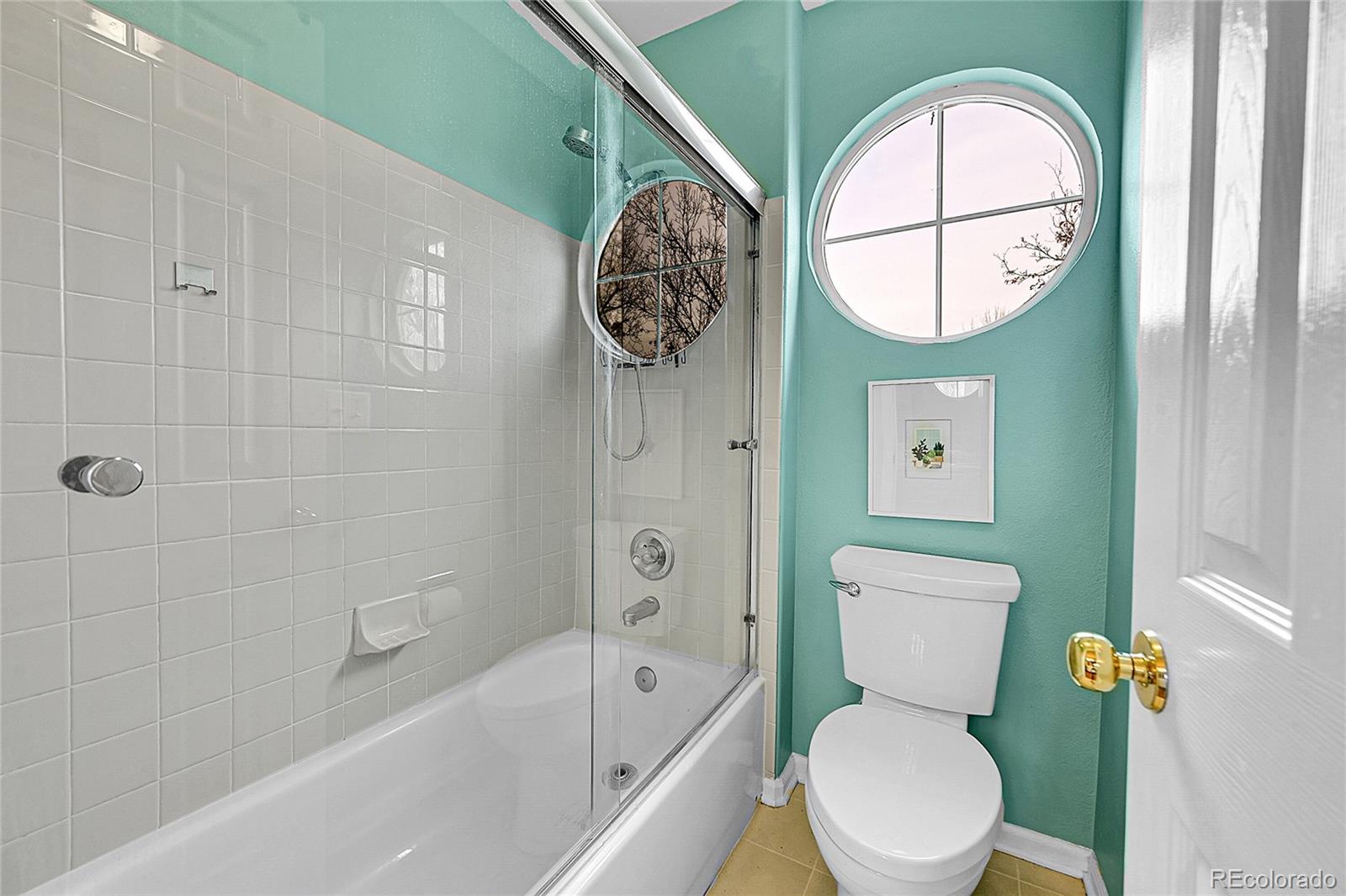 9424 South Hackberry Lane Highlands Ranch, CO 80129 - Photo 27 of 47 a white toilet sitting next to a bathroom sink and tub