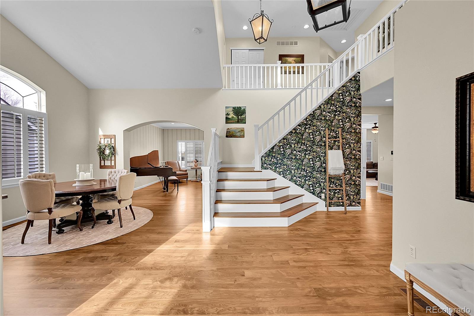 9424 South Hackberry Lane Highlands Ranch, CO 80129 - Photo 3 of 47 a view of entryway and hall with wooden floor