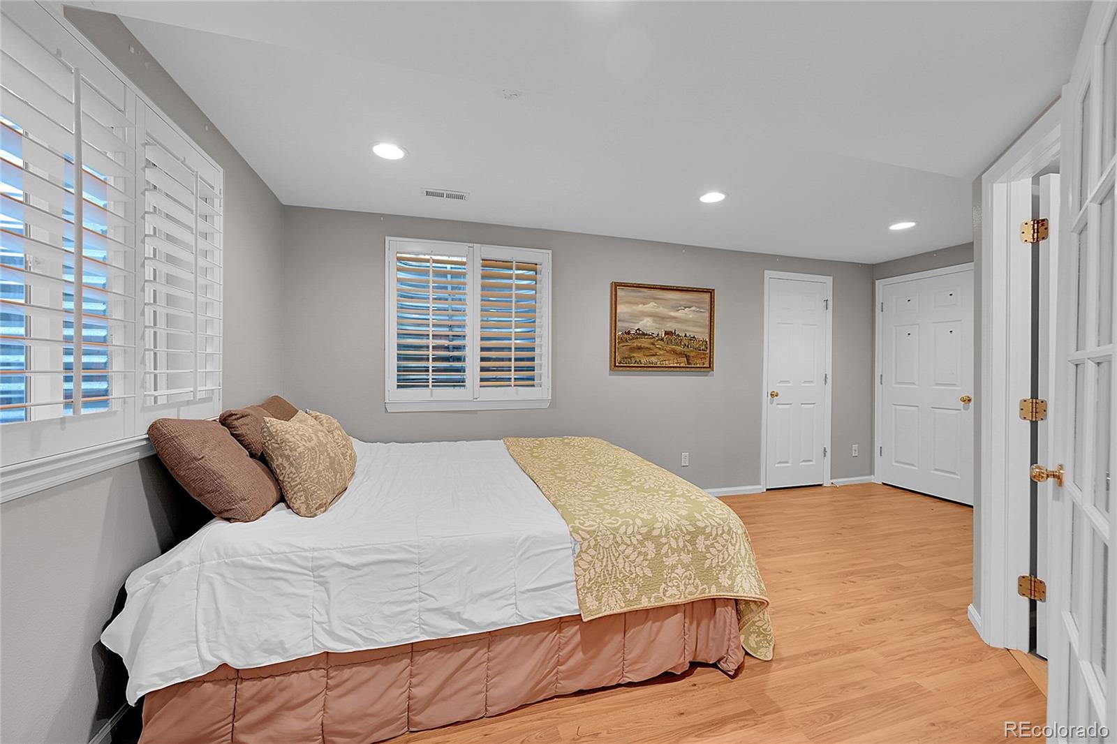 9424 South Hackberry Lane Highlands Ranch, CO 80129 - Photo 37 of 47 a bedroom with a large bed and a window
