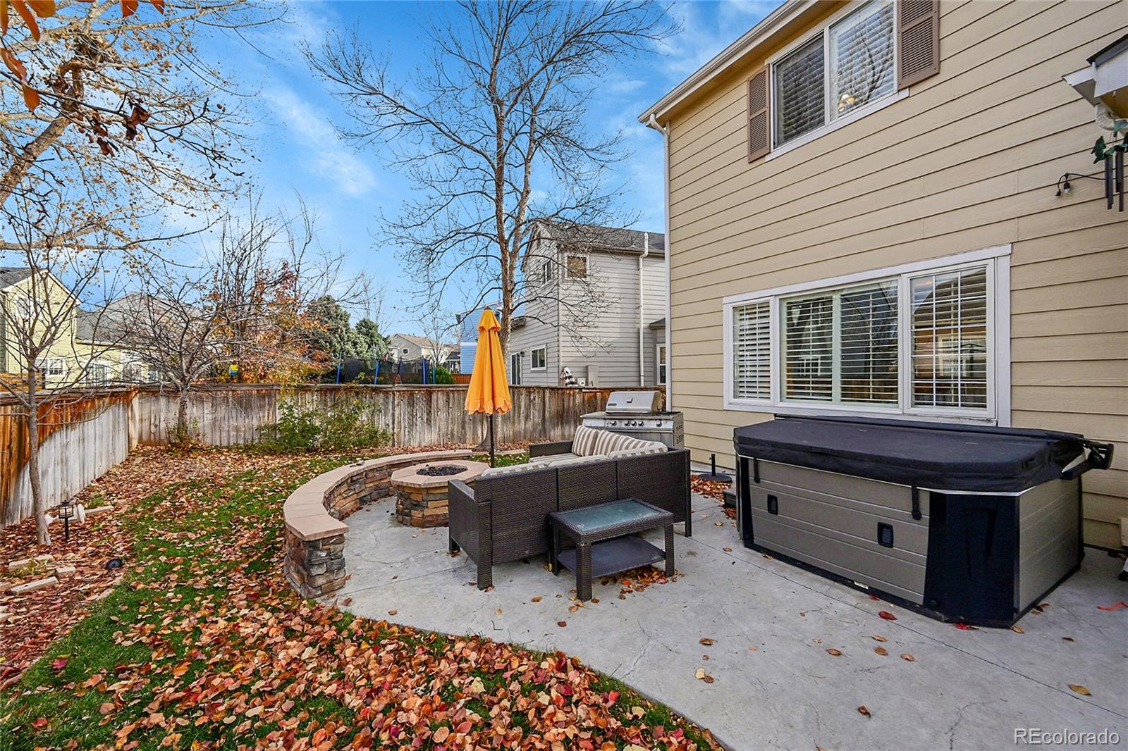 9424 South Hackberry Lane Highlands Ranch, CO 80129 - Photo 41 of 47 a view of a roof deck with table and chairs with wooden floor and fence