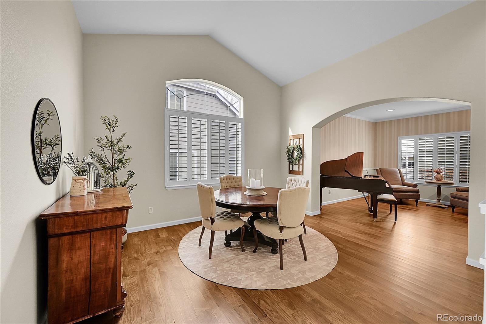 9424 South Hackberry Lane Highlands Ranch, CO 80129 - Photo 6 of 47 a living room with furniture a window and a potted plant
