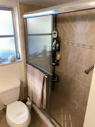 a bathroom with a toilet and a sink