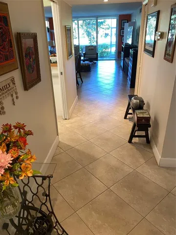a bedroom with two beds and painting on the wall