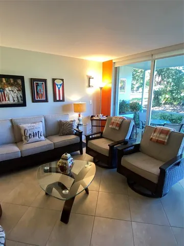 a view of a very nice looking dining room with furniture
