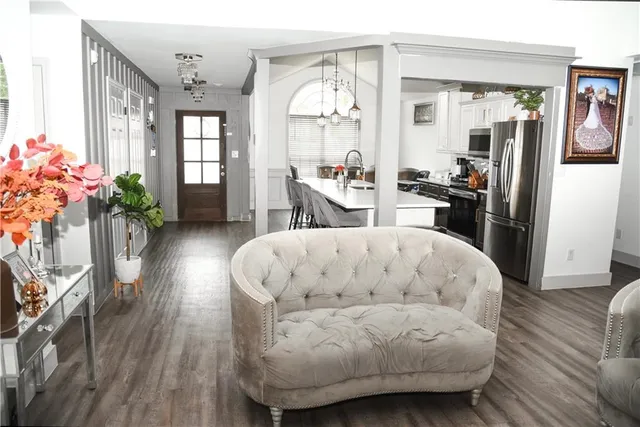 a living room with furniture and a large window