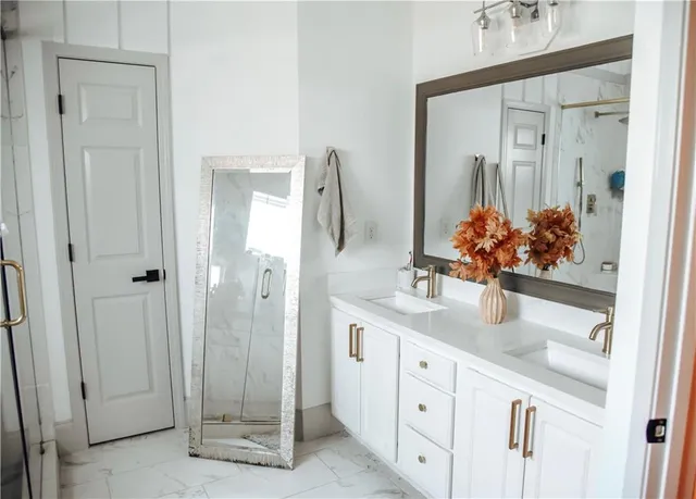 a bathroom with a sink and mirror