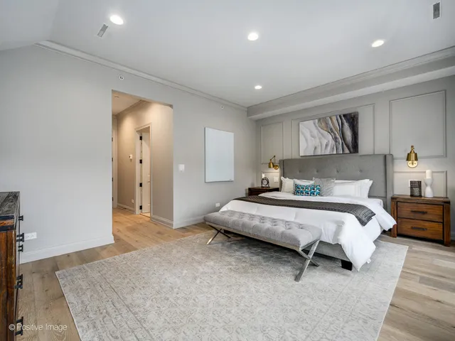 a spacious bedroom with a bed and a couch