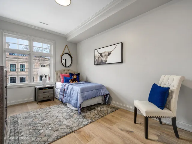 a bed room with furniture and a window