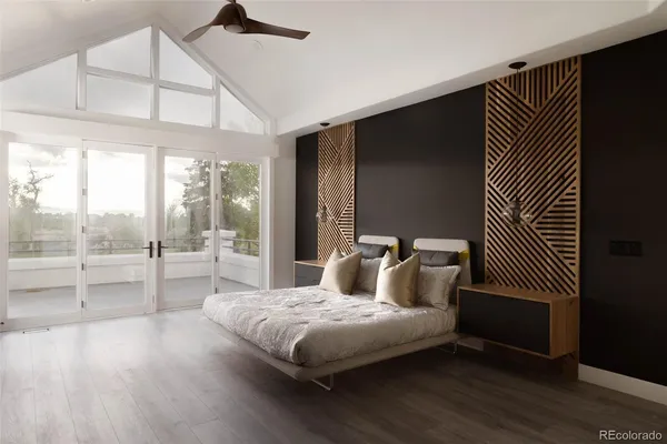 a bedroom with a bed and a large window