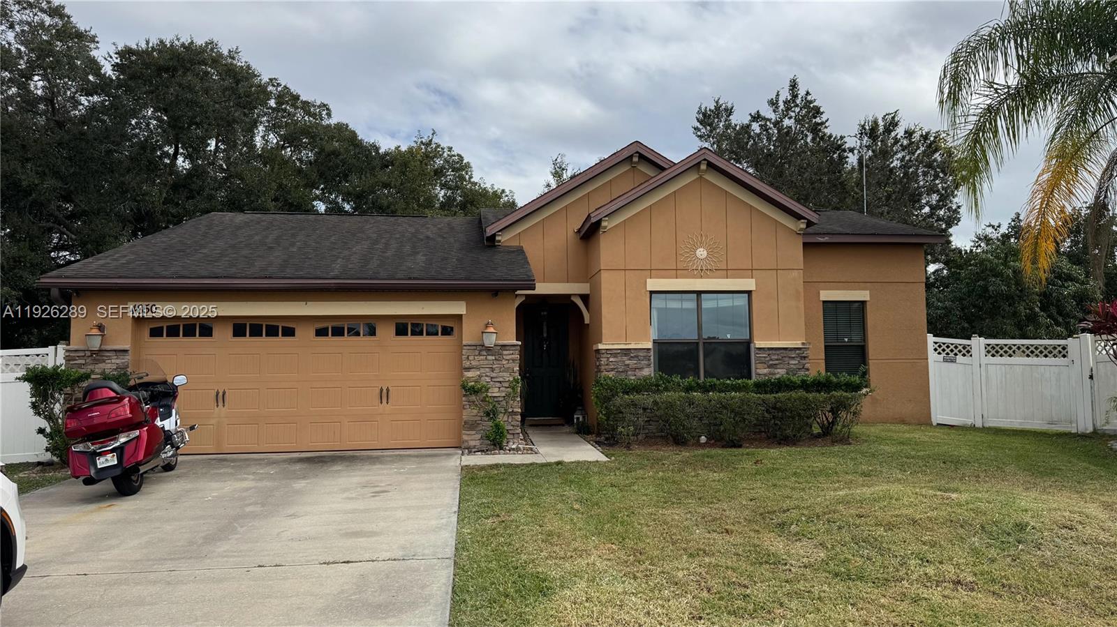 a front view of a house with a garage