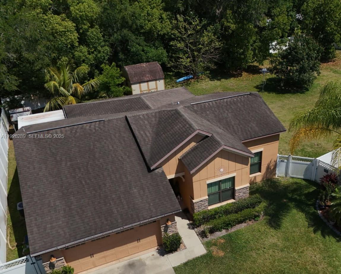 4850 Ashurst Street Kissimmee, FL 34758 - Photo 3 of 5 an aerial view of a house with a yard