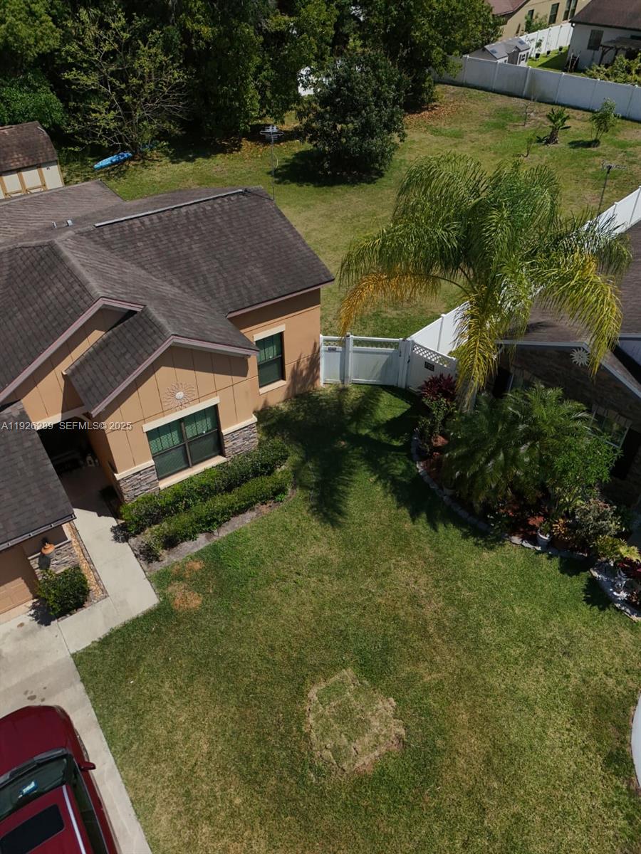 4850 Ashurst Street Kissimmee, FL 34758 - Photo 4 of 5 an aerial view of house with yard
