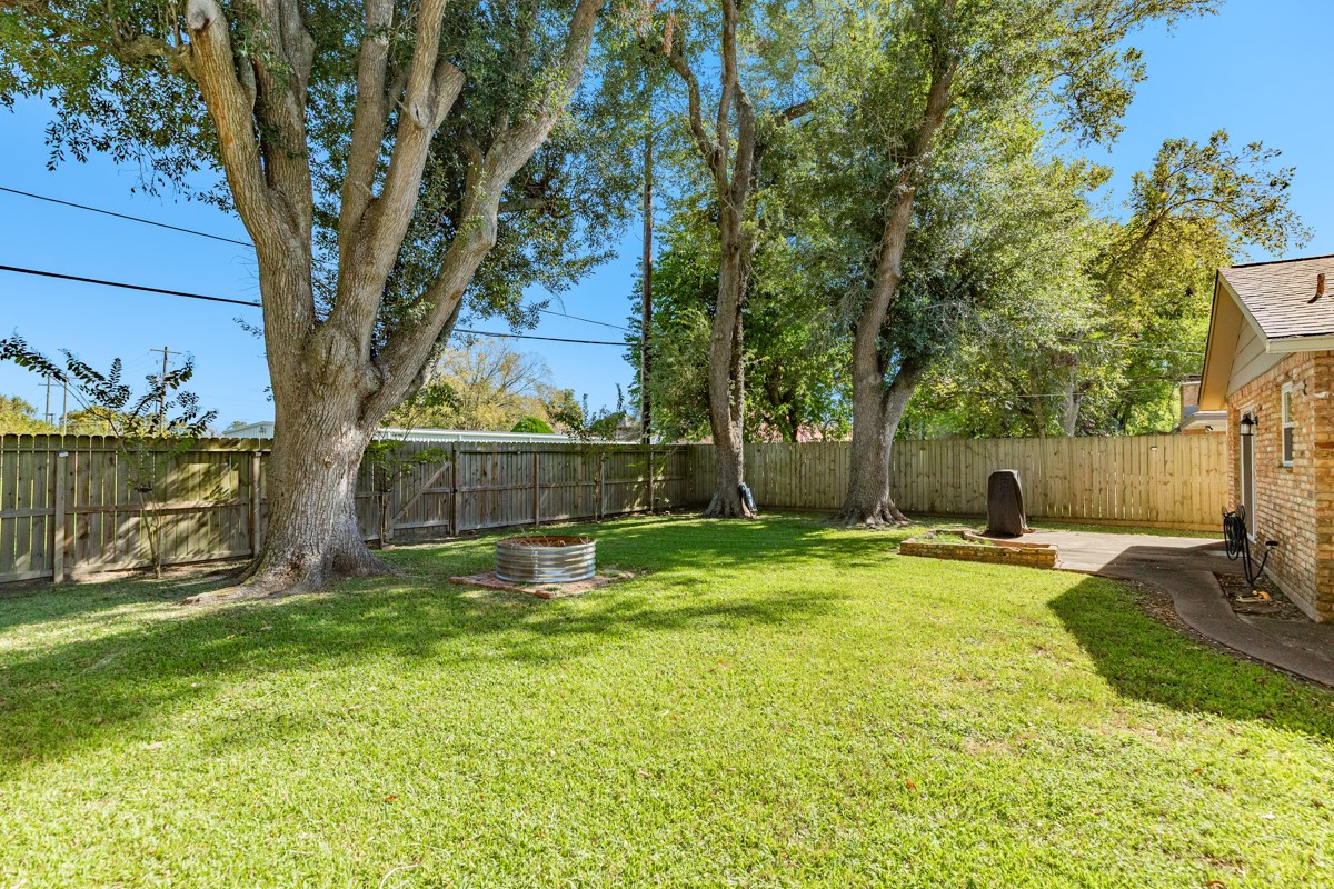 820 Perry Street Angleton, TX 77515 - Photo 7 of 26 a house with swimming pool in front of it