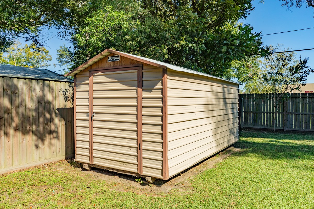 820 Perry Street Angleton, TX 77515 - Photo 8 of 26 a view of a back yard of the house