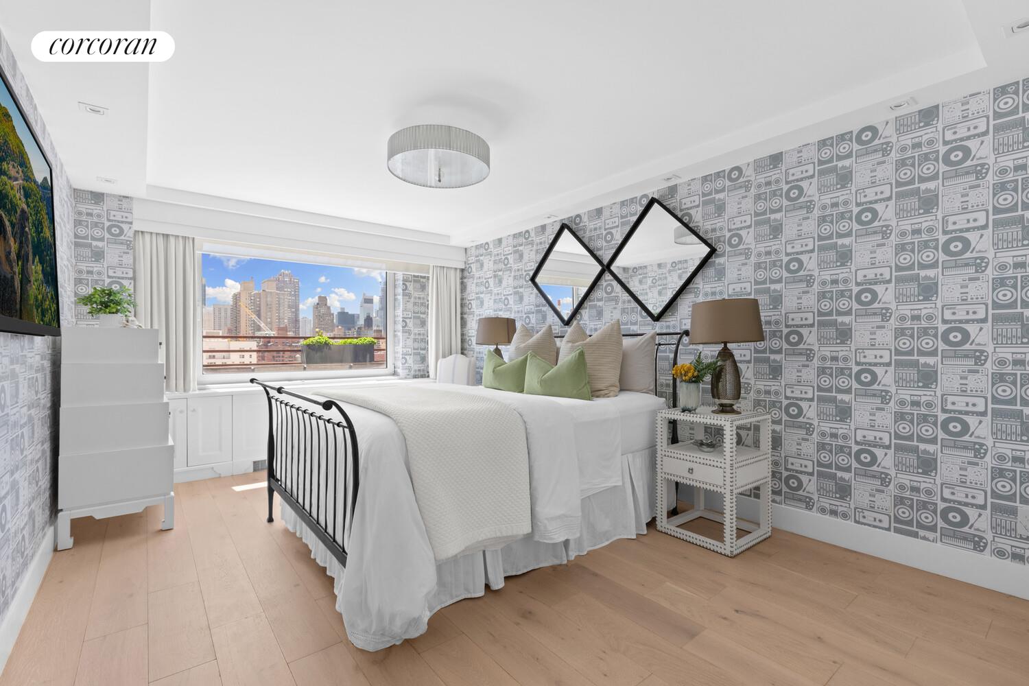 505 East 79th Street, Unit 19B Manhattan, NY 10075 - Photo 9 of 19 a bed room with a bed and a chair